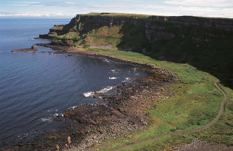Belfast Giant's Causeway and Titanic Distillery Whiskey Tour - Dunluce Castle: cliff-edge views and a good story stop